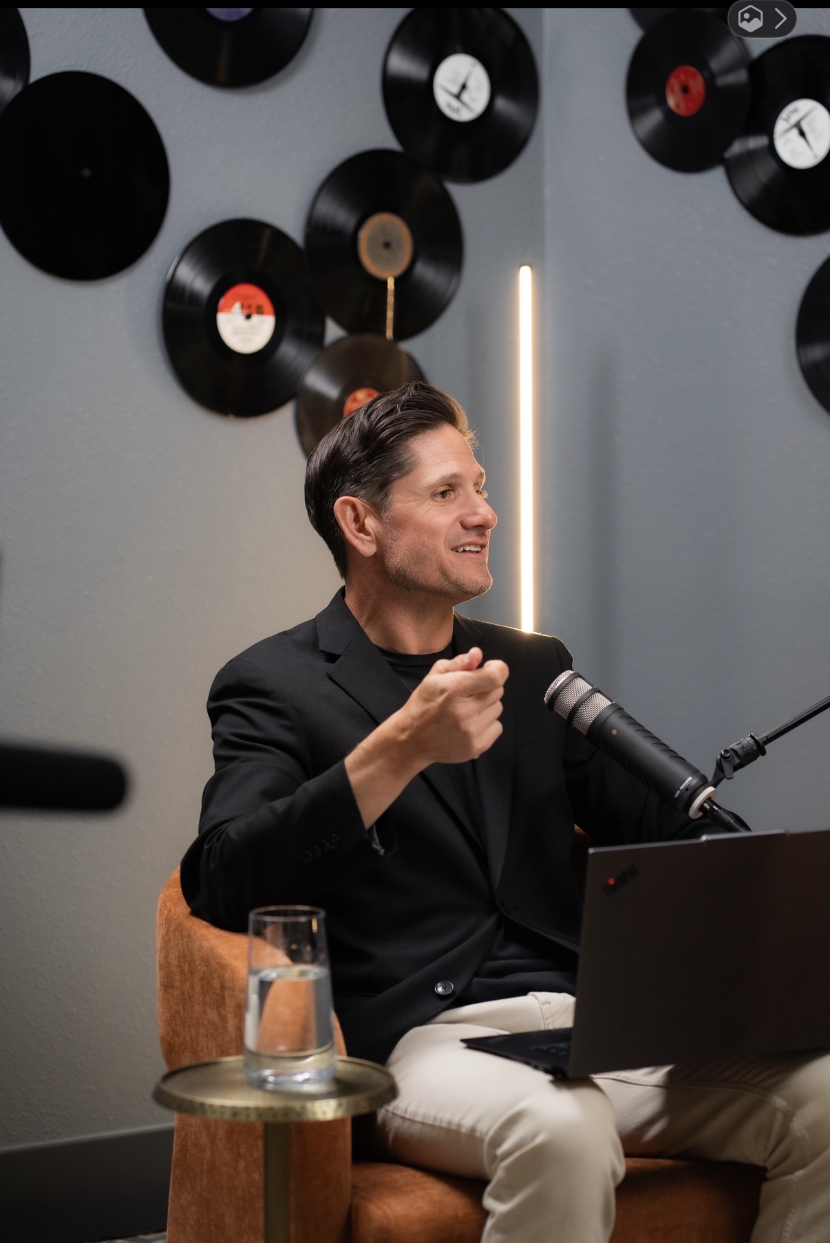 Adam Kasick speaking during a podcast recording